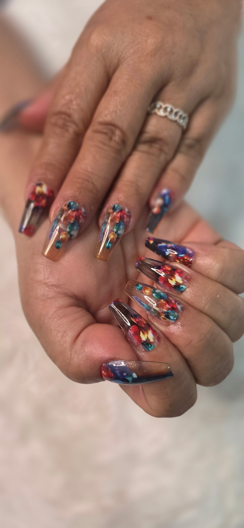 Clear coffin nails with colorful embedded gem confetti design